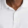 El polo de golf Performance: liso y a rayas